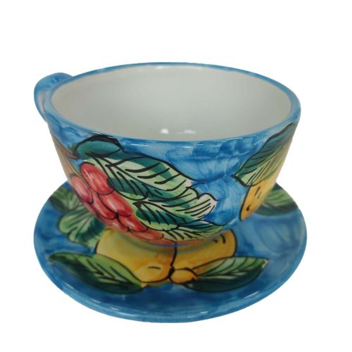 Taza de leche/tapa/té. Línea de casas con fondo amarillo....