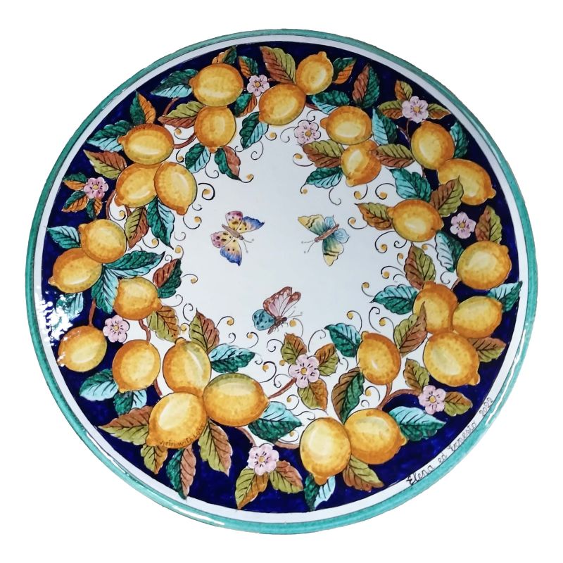 Mesa de piedra de lava redonda ceramicizada limones y mariposas pintado a mano. Cerámica Vietri