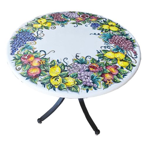Table. Ceramic-coated lava stone table. Lemons and...