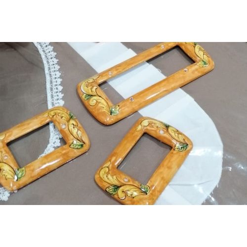 Switch coverorange background. handpainted Vietri ceramic