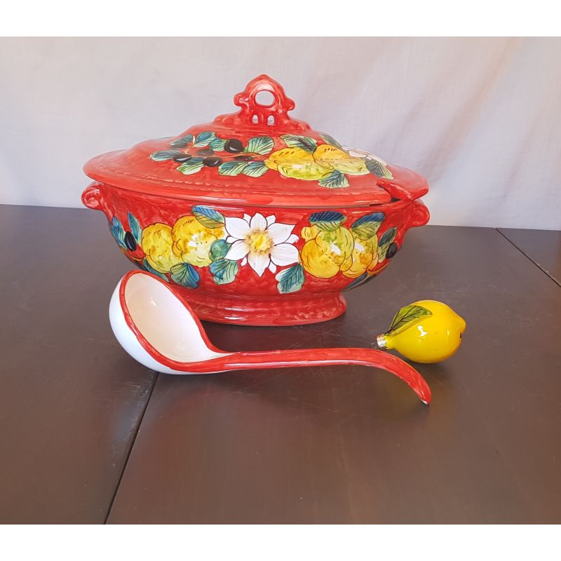 Soup tureen with ladle olive and lemons line...