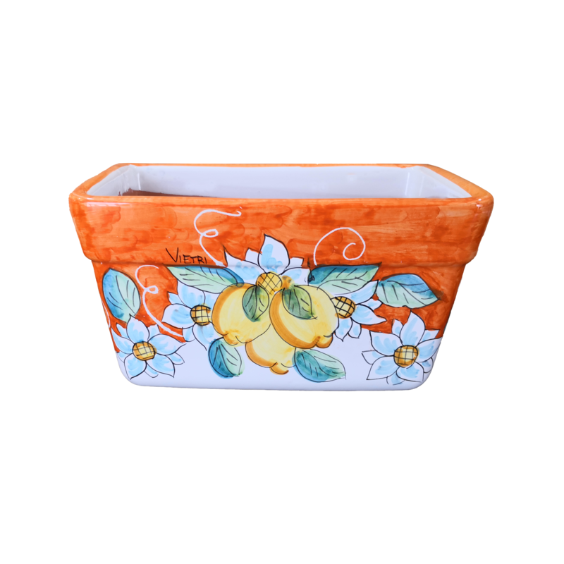 Jardinera rectangular. Fondo naranja con flores...